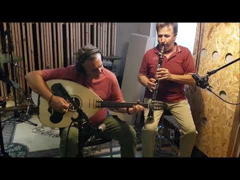 Playing the laouto next to a clarinet player